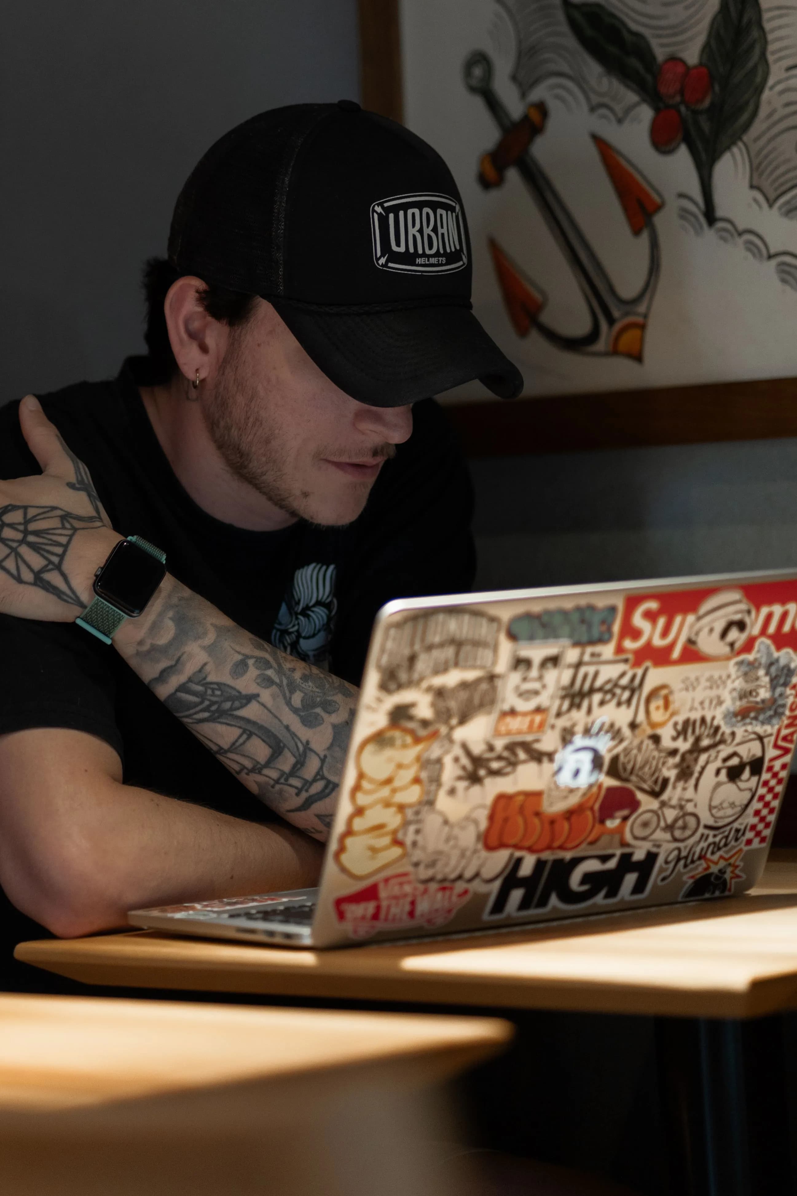 Freight broker reviewing load status at a laptop